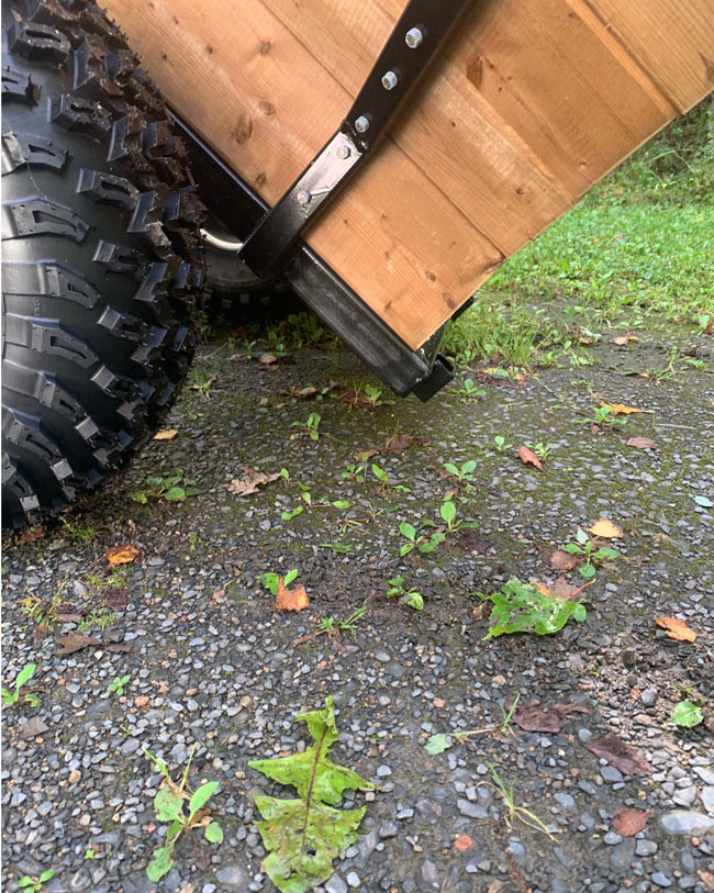 Walking beam woods trailer with a swivel hitch